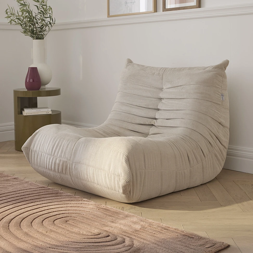 Fauteuil en velours côtelé crème